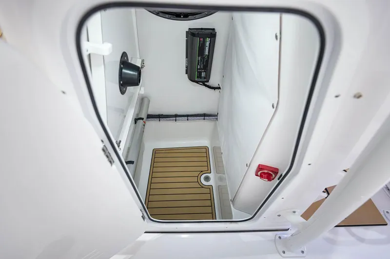Slide: The Image of Manufacturer Provided Image: 2021 Sportsman Open 242 Center Console storage compartment interior. - 40