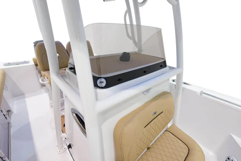 Slide: The Image of 2021 Sportsman Open 242 Center Console boat covered in blue tarp on trailer. - 6