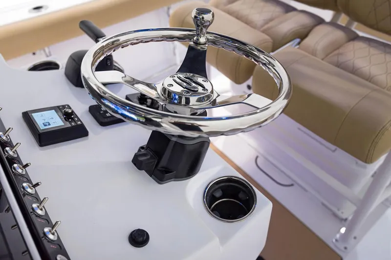 Slide: The Image of 2021 Sportsman Open 242 Center Console with illuminated dashboard and blue ambient lighting. - 8