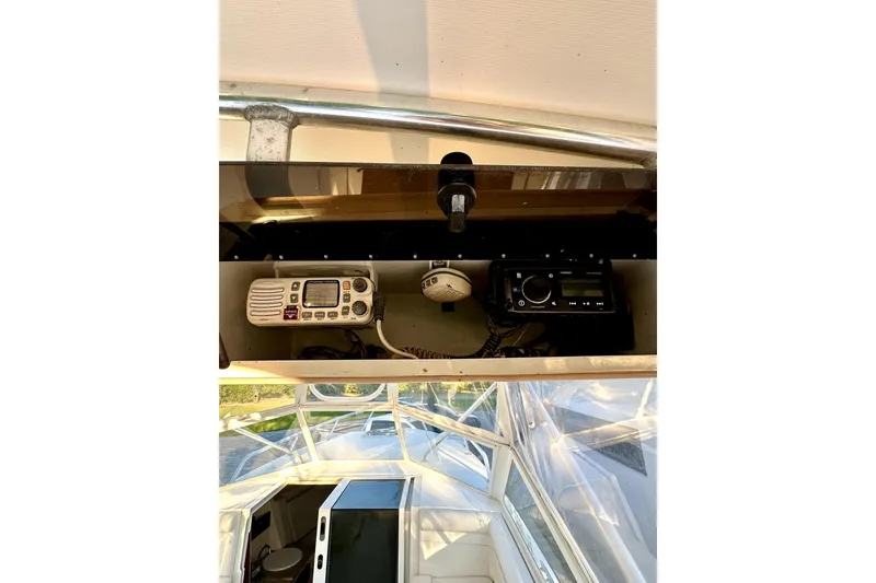 Slide: The Image of 2006 Contender 35 Express Side Console with radio and navigation equipment. - 11