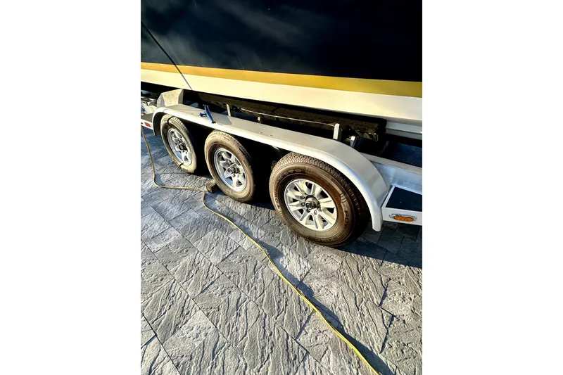 Slide: The Image of Trailer with triple axles for 2006 Contender 35 Express Side Console boat. - 15