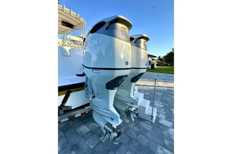 Slide: The Image of Twin Suzuki 350 outboard engines on a 2006 Contender 35 Express Side Console boat. - 24