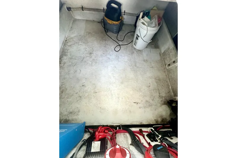 Slide: The Image of 2006 Contender 35 Express Side Console interior with equipment and storage items. - 7