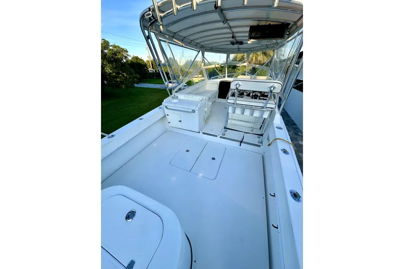 Slide: The Image of 2006 Contender 35 Express Side Console boat with spacious deck and seating area. - 8