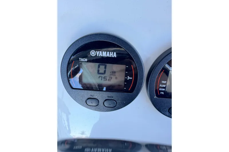 Slide: The Image of Yamaha tachometer on 2023 Edgewater 188CC boat dashboard, displaying 752 hours. - 17