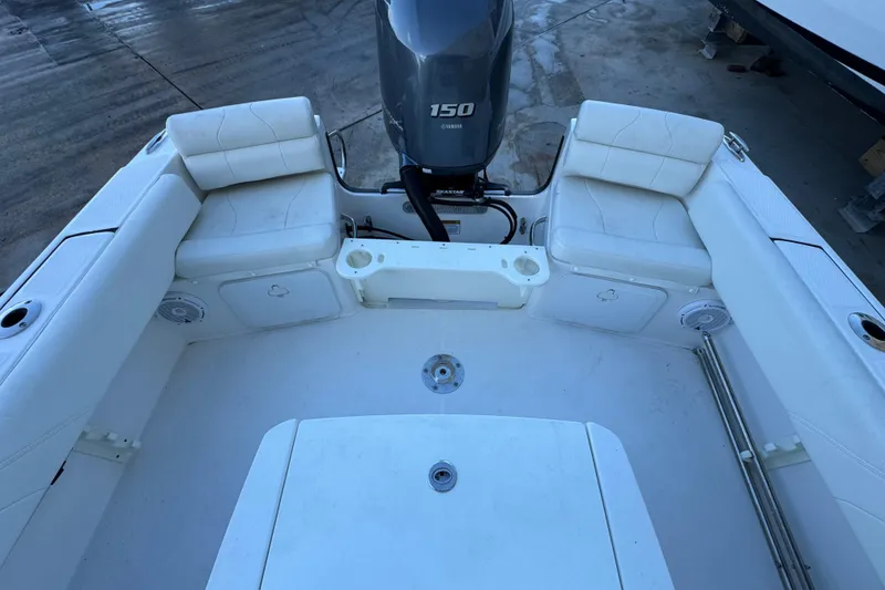 Slide: The Image of 2023 Edgewater 188CC boat interior with seating and Yamaha 150 engine. - 8