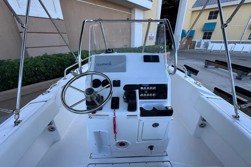 Slide: The Image of 2023 Edgewater 188CC boat console with Garmin navigation system and steering wheel. - 9