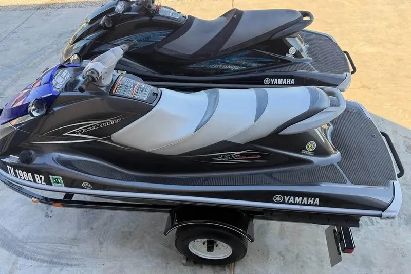 Slide: The Image of 2013 Yamaha WaveRunner VXR jet skis on a trailer, ready for adventure. - 2