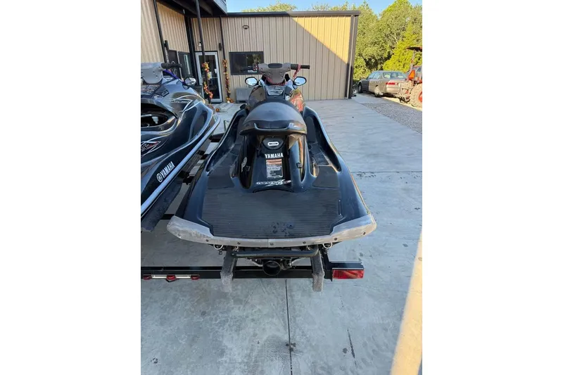 Slide: The Image of 2013 Yamaha WaveRunner VXR jet ski on trailer, parked outdoors. - 4