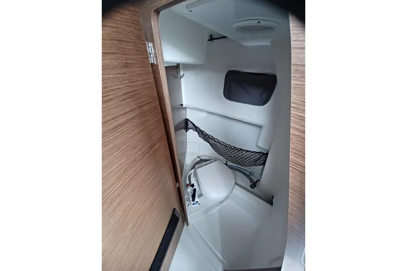 Slide: The Image of 2022 Jeanneau NC 695 Sport Serie 2 boat interior with compact bathroom. - 12