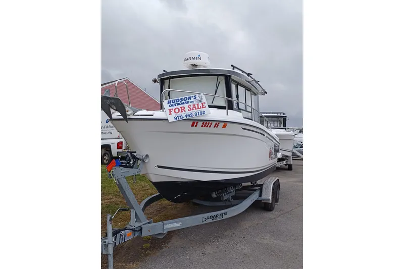 Slide: The Image of 2022 Jeanneau NC 695 Sport Serie 2 boat for sale on trailer, overcast sky. - 4
