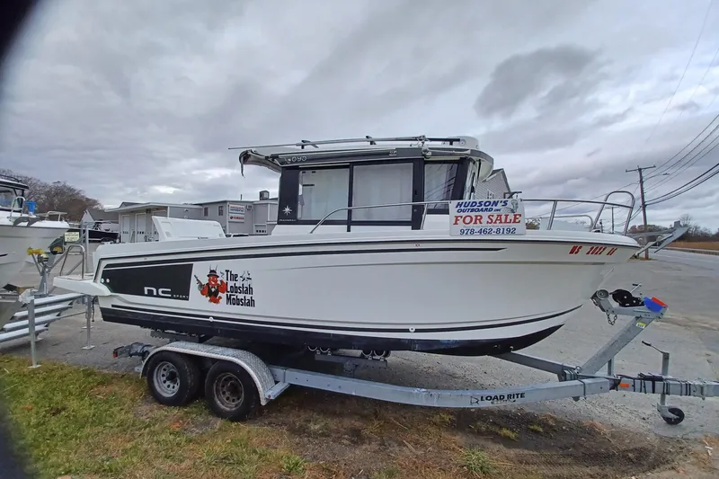 Slide: The Image of 2022 Jeanneau NC 695 Sport Serie 2 boat for sale on trailer, overcast sky. - 5
