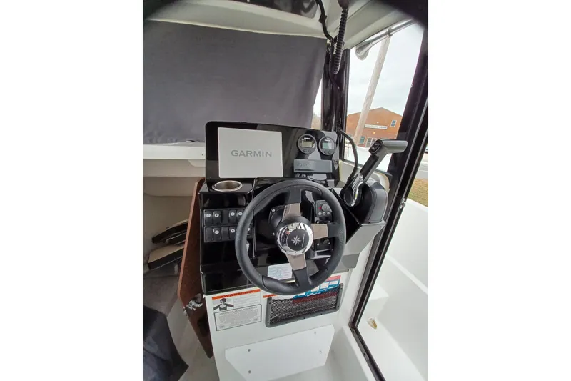 Slide: The Image of 2022 Jeanneau NC 695 Sport Serie 2 helm with Garmin navigation system. - 8