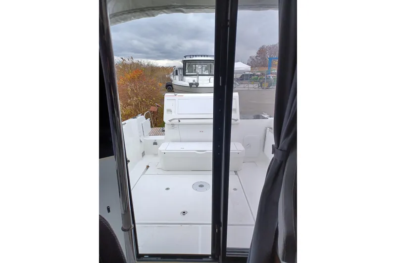 Slide: The Image of 2022 Jeanneau NC 695 Sport Serie 2 boat interior view with outdoor seating. - 9