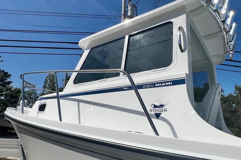 Slide: The Image of 2026 Steiger Craft 23 DV Miami boat with sleek design under clear blue sky. - 10