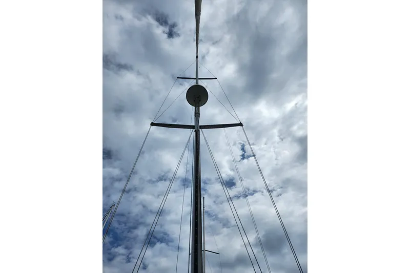 Slide: The Image of Mast of 1988 Sabre 42 sailboat against cloudy sky. - 11