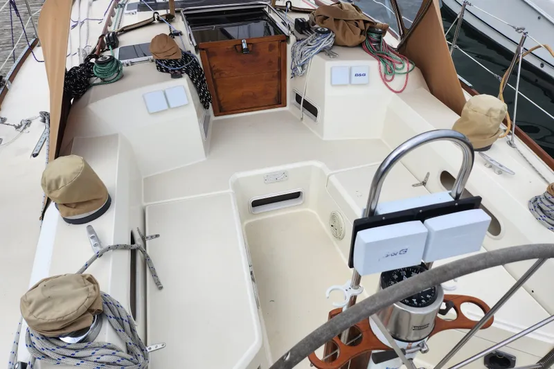 Slide: The Image of Cockpit of a 1988 Sabre 42 sailboat with ropes and navigation equipment. - 14