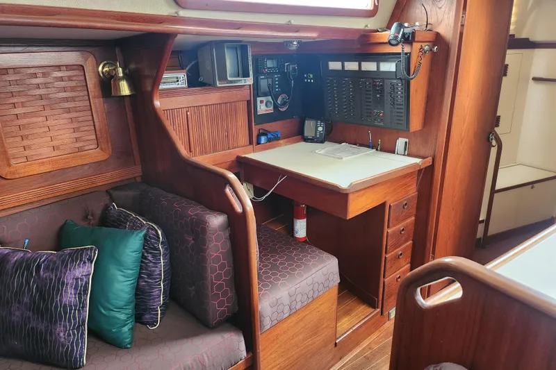 Slide: The Image of Interior of a 1988 Sabre 42 sailboat with navigation station and seating area. - 26