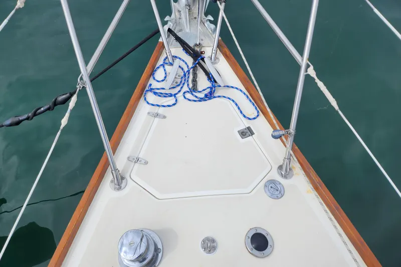 Slide: The Image of Bow of 1988 Sabre 42 sailboat with ropes and fittings on deck. - 7