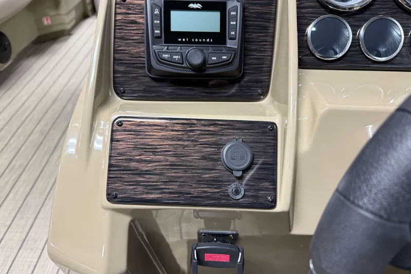 Slide: The Image of Dashboard of 2026 Sylvan Mirage 8520 Party Fish with audio controls and gauges. - 12