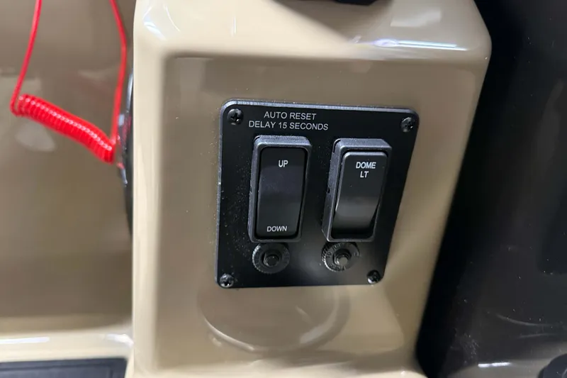 Slide: The Image of Control panel of 2026 Sylvan Mirage 8520 Party Fish with switches and red cord. - 14