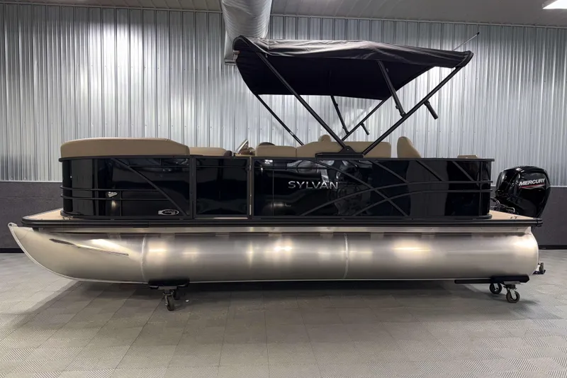 Slide: The Image of 2026 Sylvan Mirage 8520 Party Fish pontoon boat in showroom, side view. - 23