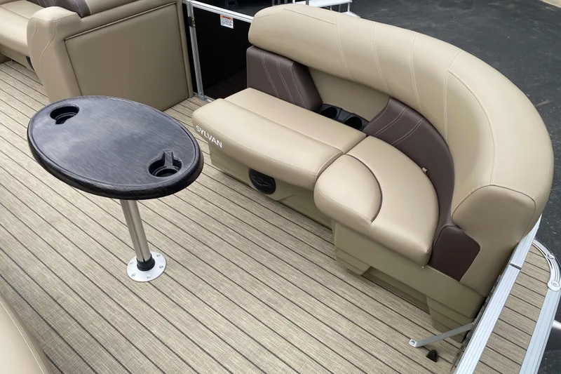Slide: The Image of Interior of 2026 Sylvan Mirage 8520 Party Fish boat with beige seating and fishing table. - 3