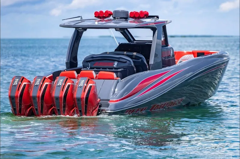 Slide: The Image of 2022 Deep Impact 399 Sport boat with quad engines on clear water. - 11