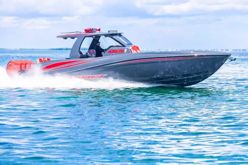 Slide: The Image of 2022 Deep Impact 399 Sport boat cruising on open water, showcasing sleek design and performance. - 15