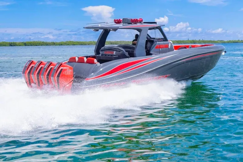 Slide: The Image of 2022 Deep Impact 399 Sport boat speeding on water, featuring multiple powerful engines. - 19