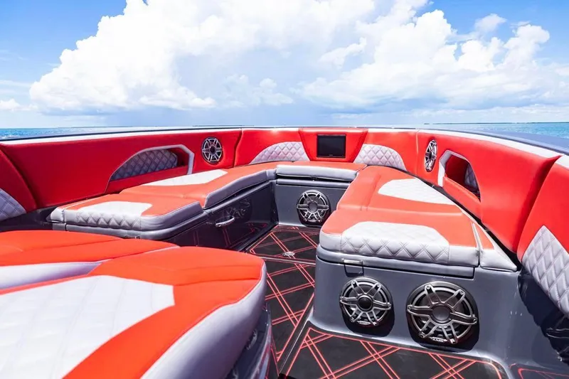 Slide: The Image of Luxurious interior of 2022 Deep Impact 399 Sport boat with red and gray seating. - 24