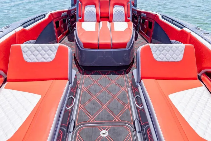 Slide: The Image of Luxurious 2022 Deep Impact 399 Sport boat interior with red and white seating. - 26