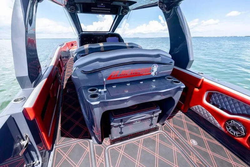 Slide: The Image of 2022 Deep Impact 399 Sport boat interior with luxury seating and ocean view. - 33