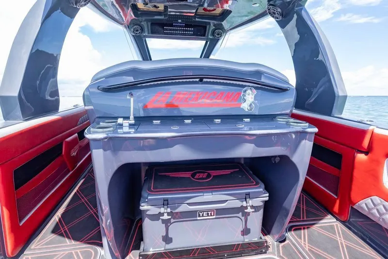 Slide: The Image of 2022 Deep Impact 399 Sport boat interior with sleek design and vibrant red accents. - 34