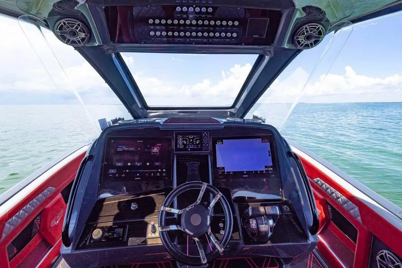 Slide: The Image of Cockpit of 2022 Deep Impact 399 Sport boat with advanced navigation systems. - 37