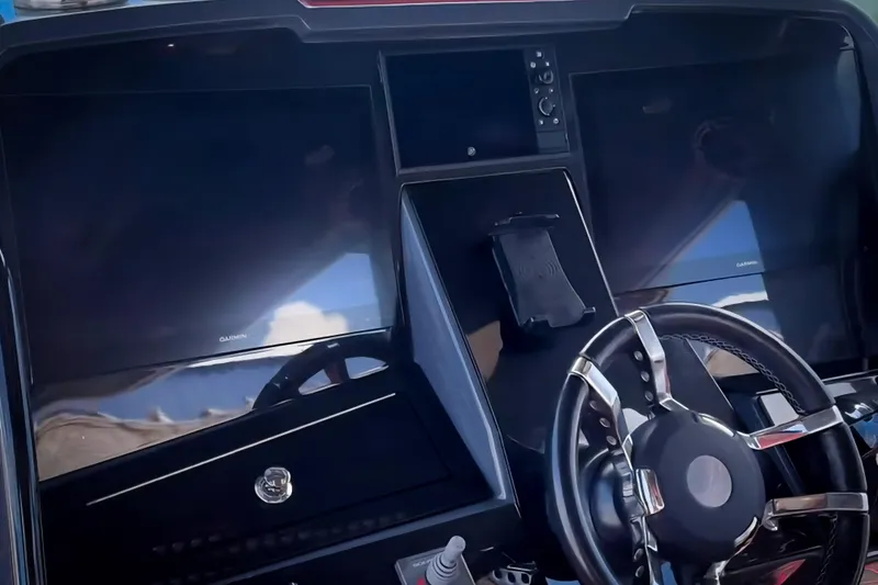 Slide: The Image of 2022 Deep Impact 399 Sport boat with quad engines on clear water. - 4