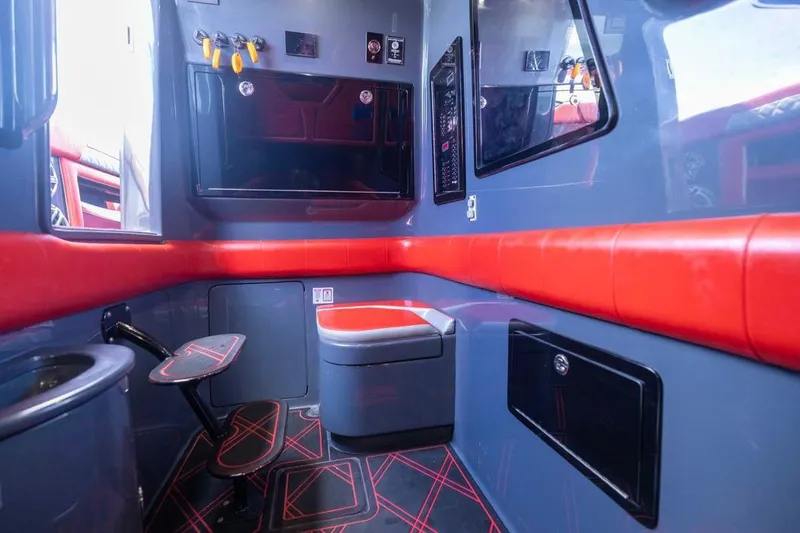Slide: The Image of Interior of 2022 Deep Impact 399 Sport boat with modern red and gray design. - 40