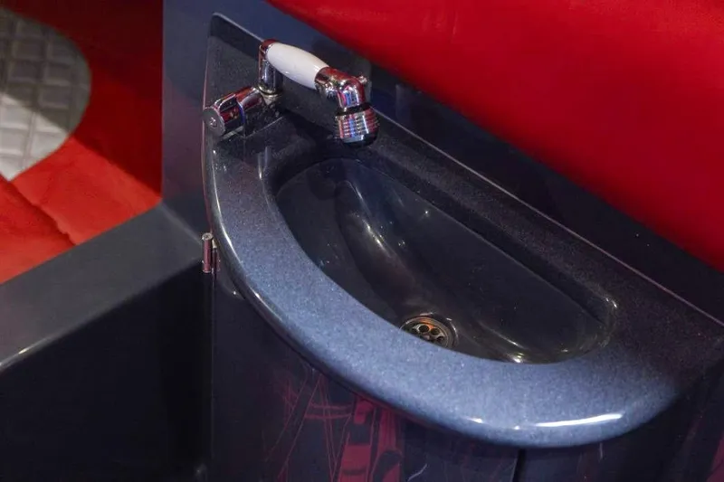 Slide: The Image of Luxury sink in 2022 Deep Impact 399 Sport boat, featuring sleek design and modern fixtures. - 41