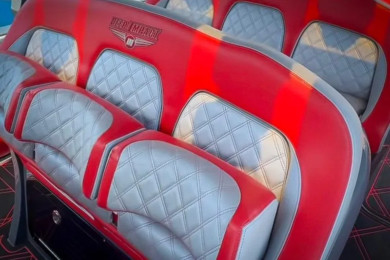 Slide: The Image of 2022 Deep Impact 399 Sport boat cruising on open water, showcasing sleek design and powerful engines. - 6