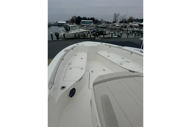 Slide: The Image of 2023 Boston Whaler 280 Dauntless dashboard with Simrad display at marina. - 11