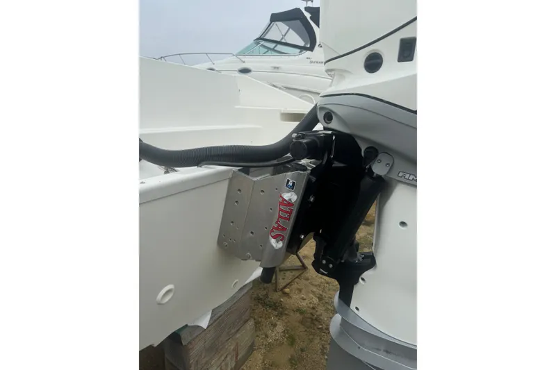 Slide: The Image of 2023 Boston Whaler 280 Dauntless boat with Mercury 400 engine, docked on land. - 4