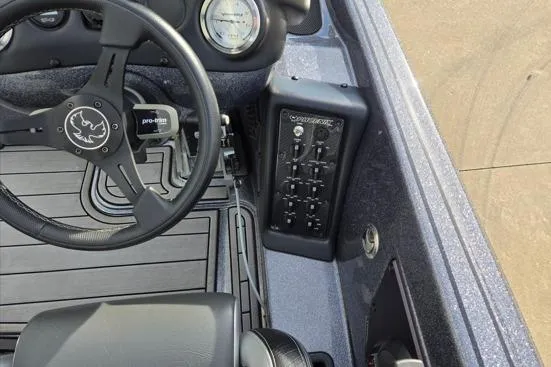 Slide: The Image of 2023 Phoenix 920 Elite boat dashboard with steering wheel and control panel. - 5