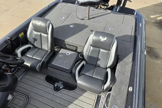 Slide: The Image of 2023 Phoenix 920 Elite boat interior with two black seats and gray flooring. - 8