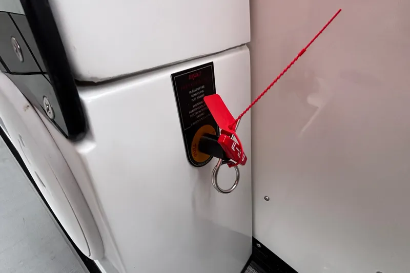 Slide: The Image of 2025 Montara 25 Surf Boss ignition with safety key and red tag. - 14