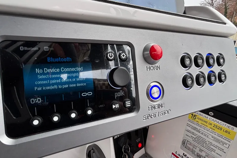 Slide: The Image of Control panel of 2025 Montara 25 Surf Boss boat with Bluetooth and engine start/stop features. - 15