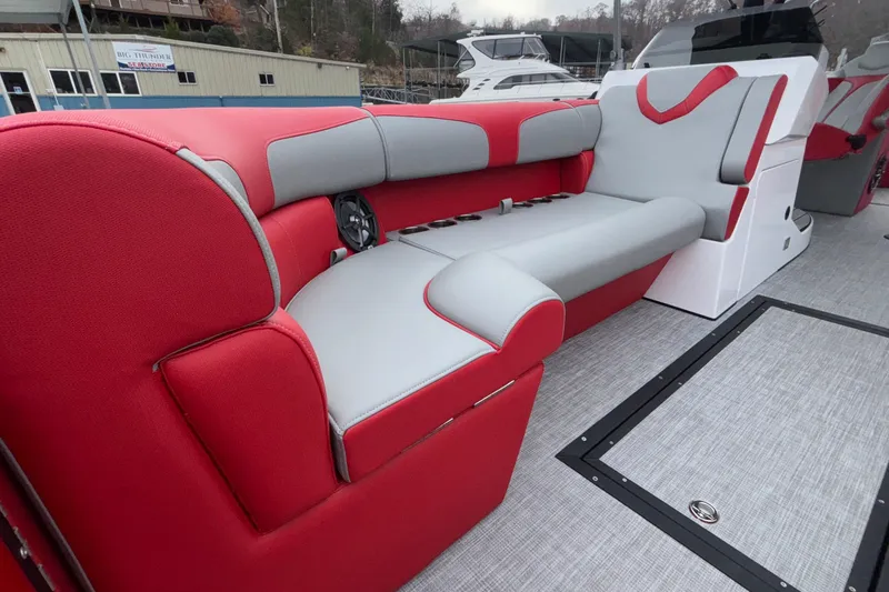 Slide: The Image of Red and gray seating on 2025 Montara 25 Surf Boss boat, featuring modern design. - 29