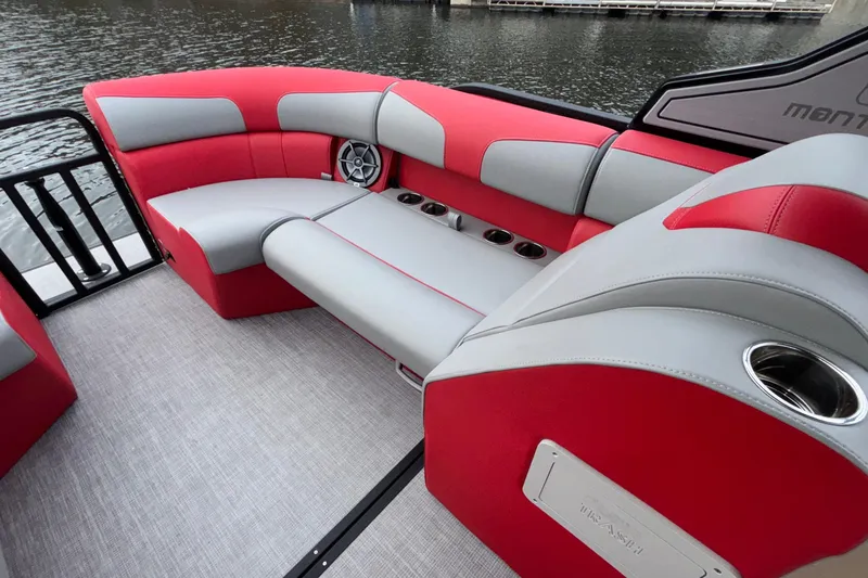 Slide: The Image of Luxurious seating on 2025 Montara 25 Surf Boss boat, featuring red and gray upholstery. - 32
