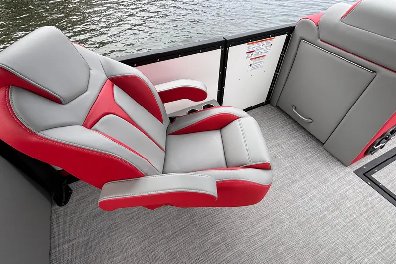 Slide: The Image of Luxurious seating on 2025 Montara 25 Surf Boss boat, featuring red and gray upholstery. - 5