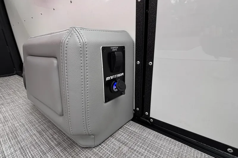 Slide: The Image of 2025 Montara 25 Surf Boss interior detail with courtesy light switch and gray upholstery. - 7