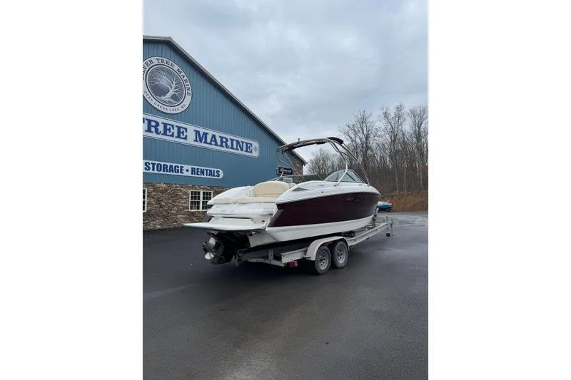 Slide: The Image of 2009 Cobalt 242 boat on trailer at Deer Tree Marine, overcast day. - 2